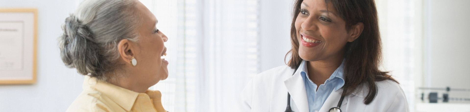 Senior woman talking to doctor